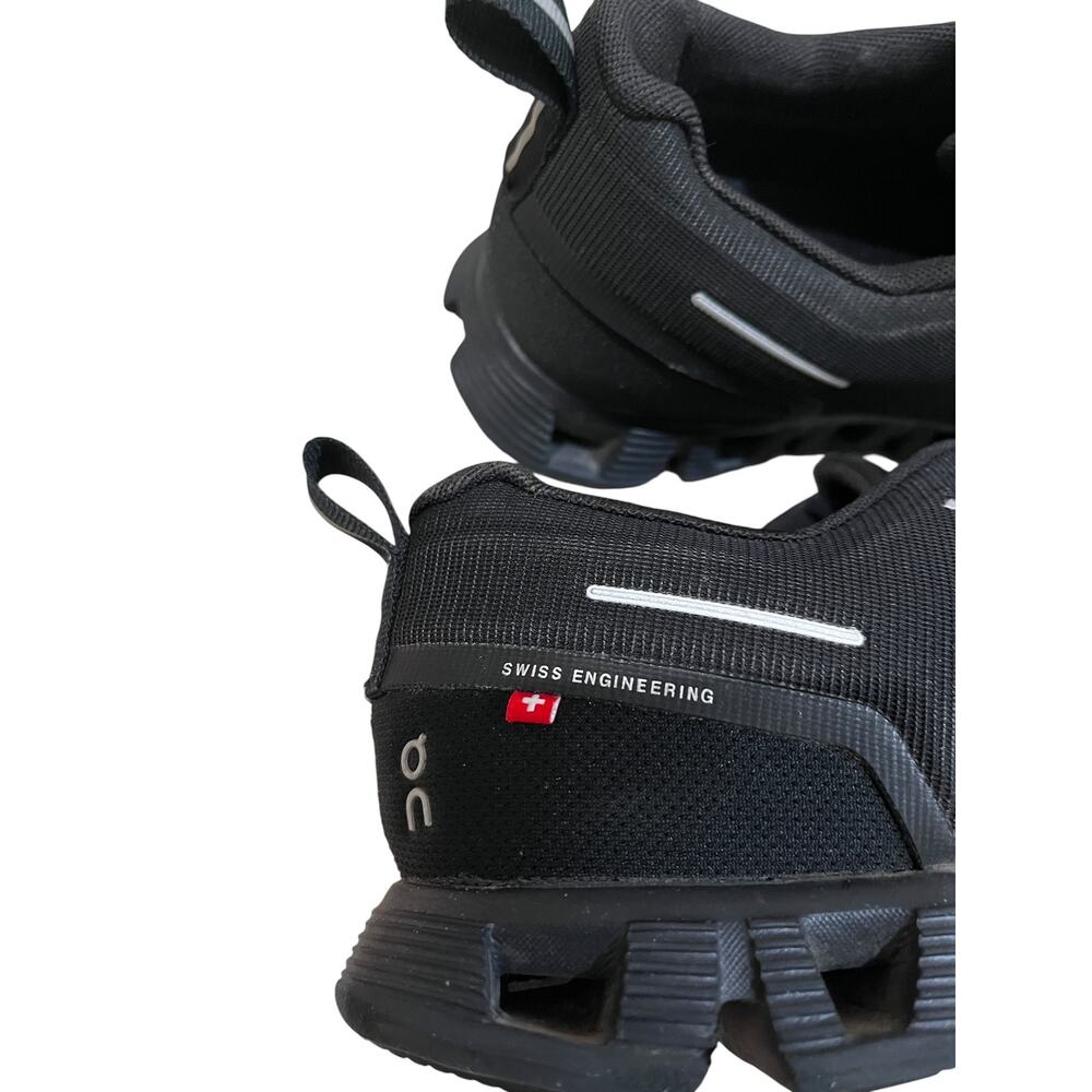 On Cloud waterproof running shoes for women in solid black. - Picture 6 of 9